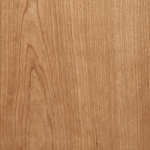 Cherry wood grain swatch — warm reddish-brown timber with a smooth, flowing grain that mellows with age, a premium choice for turned furniture legs and decorative pieces